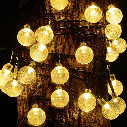 Warm white globe lights at night