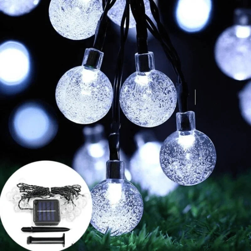 White globe lights with solar panel and stake