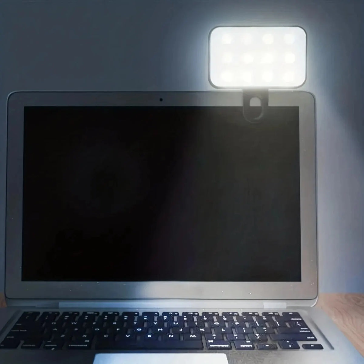 Clip-on LED light on a laptop